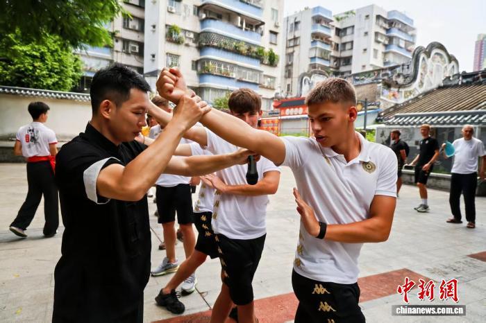 Football tournament players experience martial arts in Guangdong
